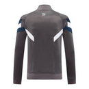 Jaqueta Corta-Vento Real Madrid 25/26 - Masculina Adidas - Cinza